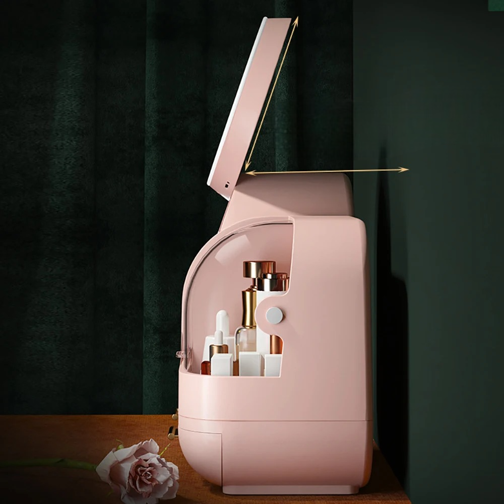 boite rangement maquillage rose posee sur table